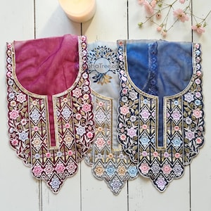 May include: A white ceramic mug with a black handle and the text "But First, Coffee" in a black, handwritten-style font. The mug is on a white surface.