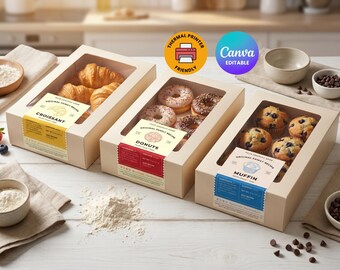 May include: Three rectangular beige cardboard boxes with clear windows, each containing baked goods. The left box holds croissants, the center box holds donuts, and the right box holds muffins. Each box features a label with text and icons.