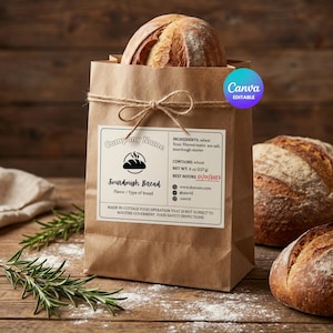 Puede incluir: Una bolsa de papel marrón atada con hilo, que contiene un pan de masa madre. La bolsa tiene una etiqueta que dice "Pan de masa madre" y enumera los ingredientes. El peso neto es de 227 g. Dos panes adicionales están en el fondo.