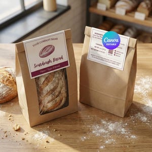 Puede incluir: Dos bolsas de papel marrón con pan de masa madre sobre una superficie de madera. Una bolsa tiene una ventana que muestra el pan y una etiqueta que dice "Sourdough Bread". La otra bolsa tiene una etiqueta con el texto "Canva EDITABLE".