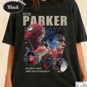 May include: A black short-sleeve t-shirt featuring a graphic print of Peter Parker and Spider-Man. The design includes the text "PETER PARKER" and "WITH GREAT POWER COMES GREAT RESPONSIBILITY," along with two circular inset images of the character.