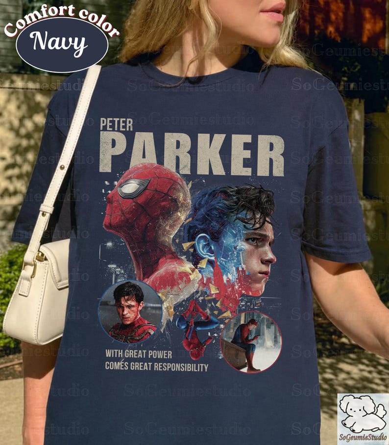 May include: A navy blue short-sleeve t-shirt featuring a graphic print of Peter Parker and Spider-Man. The design includes the text "PETER PARKER" and "WITH GREAT POWER COMES GREAT RESPONSIBILITY," along with two circular insets showing the character.