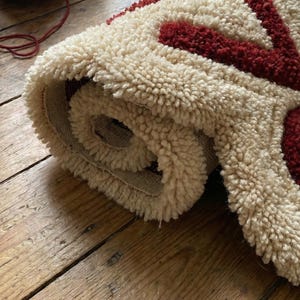 Hand-tufted wool floor rug with custom CSS code design, perfect for modern geeky home décor. Soft and cozy underfoot, this personalized rug adds a unique tech-inspired accent to living rooms, bedrooms, or offices. A stylish, functional piece that merges contemporary design with playful coding aesthetics for tech-savvy homeowners