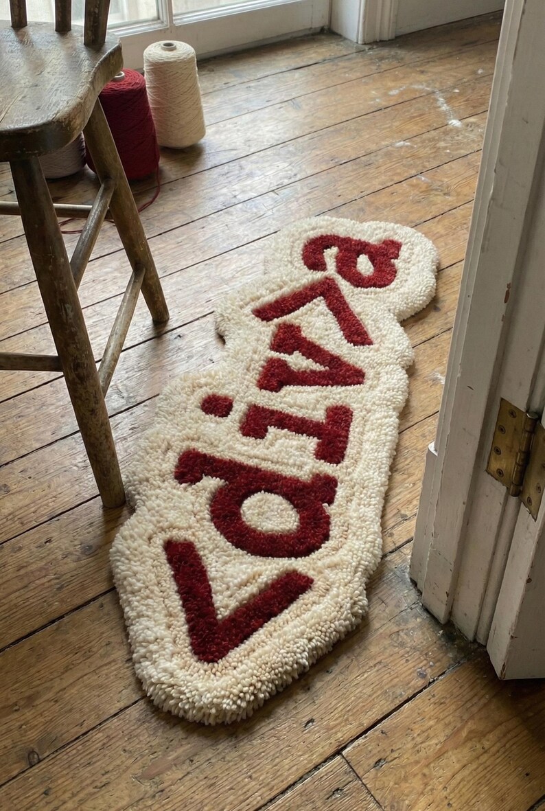 Modern tech-inspired hand-tufted wool rug featuring CSS code motifs, ideal as a personalized door mat or floor accent. Soft, plush, and durable, this geeky rug elevates living rooms, bedrooms, or office spaces with contemporary charm. A unique statement piece that combines comfort, style, and playful tech-themed design in one functional mat.