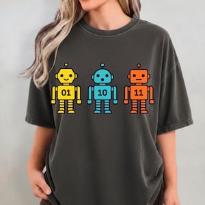 Peut inclure: Mug en céramique blanche avec une anse noire et l'inscription "But First, Coffee" en noir. Le design épuré du mug se détache sur un fond flou.