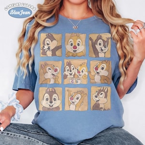 May include: Blue Comfort Colors t-shirt featuring a grid of Chip and Dale cartoon images. The shirt has the text "Comfort Colors Blue Jean" in a circular design at the top left.