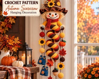 May include: A crochet hanging decoration featuring a scarecrow with a brown hat, a red scarf, and a spiral body. The piece includes dangling elements like sunflowers, pumpkins, acorns, maple leaves, and blue overalls. Text reads PDF FILE CROCHET PATTERN Autumn Scarecrow Hanging Decoration.