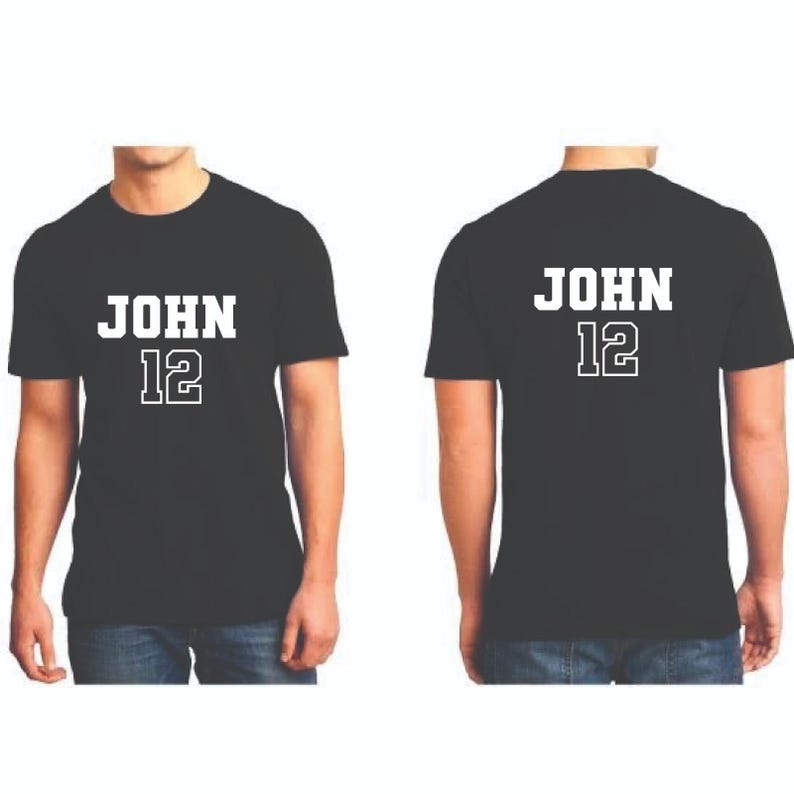 May include: Black t-shirts with the name "JOHN" and the number "12" printed in white. The front and back of the shirts are displayed. The text is in a bold, blocky font.
