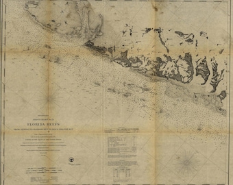 May include: A vintage nautical chart titled Coast Chart No. 71 Florida Reefs from Newfound Harbor Key to Boca Grande Key. The map features detailed topographical outlines of islands, numerous depth soundings, a compass rose, and text blocks.