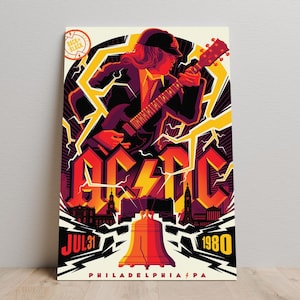 Op de afbeelding: Een vintage poster met een gitarist en de bandnaam "AC/DC" in vette letters. De poster heeft een retro-ontwerp met bliksemflitsen en de datum "JUL 31 1980" en de stad "PHILADELPHIA PA".