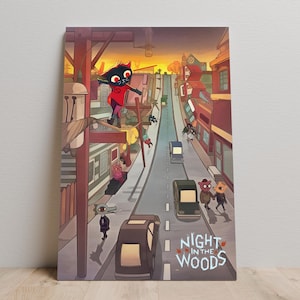 May include: A canvas print with a colourful illustration from "Night in the Woods." The artwork shows anthropomorphic animals in a town setting, with a cat-like character in a red outfit. The title "Night in the Woods" is displayed at the bottom of the image.
