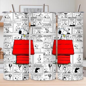 May include: Three stainless steel tumblers featuring a comic strip design with Snoopy and his red doghouse. The black and white comic strip includes speech bubbles and the word "PEANUTS". Each tumbler has a silver straw.