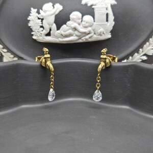 Whimsical Elegance: Gold-Tone Water Tap Earrings with Clear Crystal Drops
