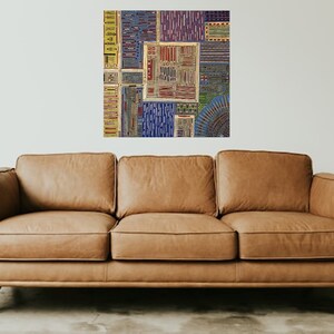 May include: A colorful abstract art print with a geometric pattern in shades of blue, yellow, red, and green. The print is made up of various squares and rectangles, creating a visually interesting and modern design.