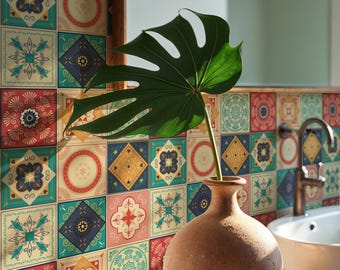 May include: A bathroom scene featuring a decorative tile backsplash with colorful geometric patterns. A terracotta vase holds a large green leaf. A white sink and faucet are visible, along with a mirror.