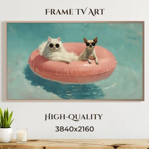 Puede incluir: Impresión artística digital enmarcada que muestra un gato blanco y un perro pequeño con gafas de sol, flotando en un flotador inflable rosa en una piscina. Las palabras "FRAME TV ART" y "HIGH-QUALITY 3840x2160" están impresas.
