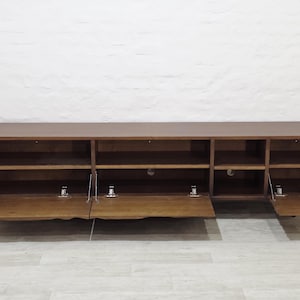 handcrafted wooden tv unit with organic carved doors