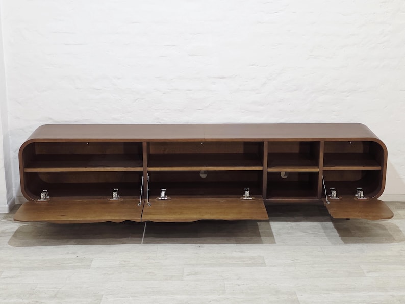 handcrafted wooden tv unit with organic carved doors