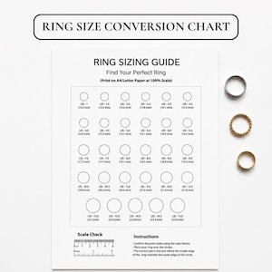 May include: A white ring sizing guide printed on paper with the text RING SIZE CONVERSION CHART and RING SIZING GUIDE. The chart features rows of circles labeled with US sizes from 1 to 15 and metric equivalents, plus a 2-inch scale check ruler.