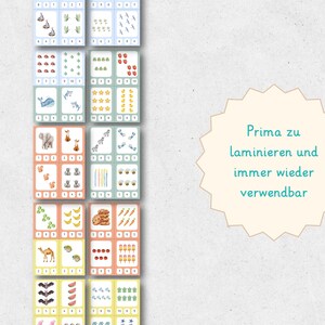 May include: Educational flashcards featuring colorful illustrations of animals, fruits, and objects, paired with corresponding numerical values. The cards are arranged in a grid, with each card displaying a different quantity and image. The text "Prima zu laminieren und immer wieder verwendbar" is also visible.