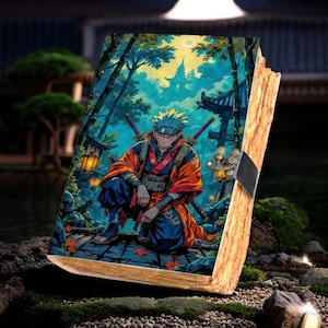 May include: A wooden book with a colorful anime illustration. The image depicts a character in an orange and blue outfit with two swords, set against a backdrop of a Japanese-style landscape with trees and buildings. The book has a metal clasp.