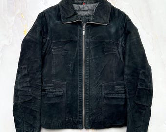 May include: A black suede jacket with a zipper closure, two front pockets, and a collared neckline. The jacket has a textured appearance and a classic design. The label reads "LS Royal Surplus".