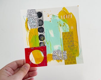 May include: Abstract art collage featuring yellow, green, blue, and red paint. The collage incorporates text from a book on chemistry and a circular shape with a yellow and red design.