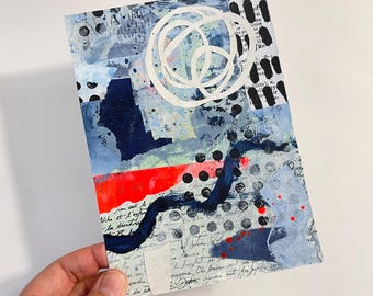 May include: Abstract mixed media artwork featuring blue, red, white and black paint. The artwork includes a white circle with a black dot in the centre, a red stripe and a black and white polka dot pattern.