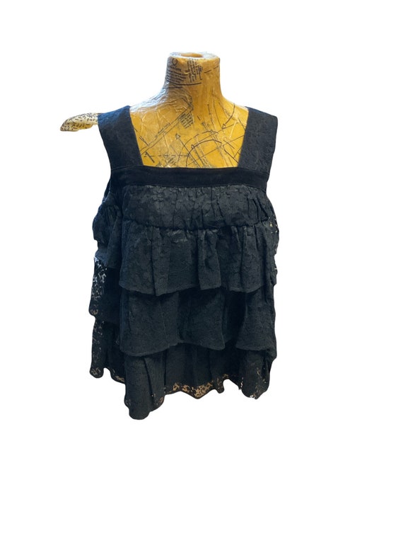 Layers of lace and velvet trim aelegant top! This 