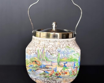 Vintage Sandland "In an Olde World Garden" Biscuit Barrel with silver-plated fittings.