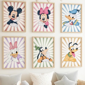 May include: Six framed Disney character prints. Mickey Mouse, Minnie Mouse, Donald Duck, Daisy Duck, Goofy, and Pluto are depicted in colourful illustrations with a retro sunburst background. The prints are in wooden frames and are displayed on a white wall.