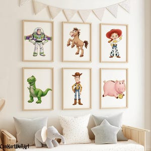 May include: Six framed prints featuring characters from the Toy Story movie. The prints include Buzz Lightyear, a horse, Jessie, Rex the dinosaur, Woody, and Hamm the piggy bank. The prints are in wooden frames and are displayed on a white wall.
