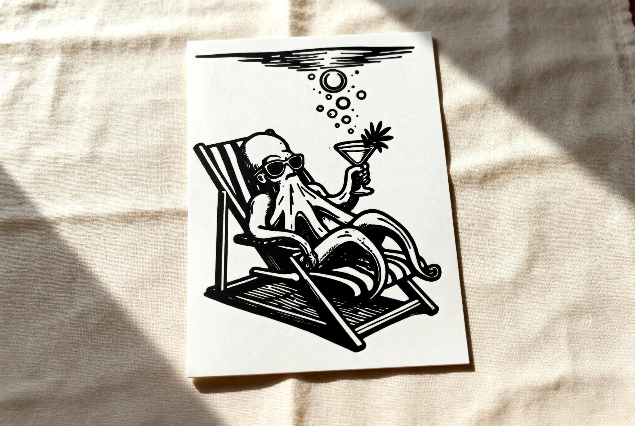 Handmade linocut print of an octopus in sunglasses lounging on a beach chair holding a cocktail
