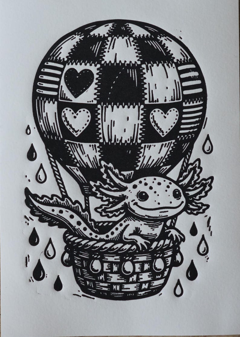 May include: Black and white illustration of an axolotl in a hot air balloon. The balloon has a checkered pattern with heart shapes. The axolotl is in a woven basket, with raindrops falling around it.