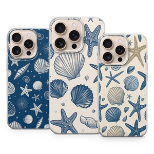 May include: Three phone cases with a sea life theme. The cases feature detailed illustrations of seashells and starfish in shades of blue and beige against a white or navy background. The cases are designed to fit a smartphone.