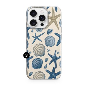 May include: A phone case featuring a beach-themed pattern. The design includes blue starfish and seashells on a beige background. The case has a clear border and a camera cutout.