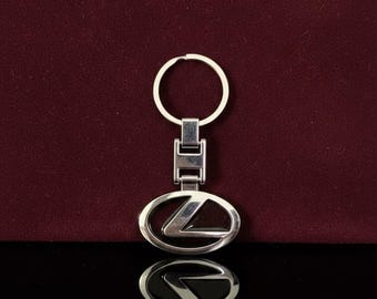 Llavero Lexus: Ovalado en plata pulida con incrustaciones negras