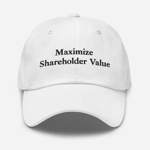 May include: A white baseball cap featuring the black embroidered text "Maximize Shareholder Value" centered on the front panel. The cap has a structured crown, a curved brim, and a button on top, with stitched eyelets for ventilation.