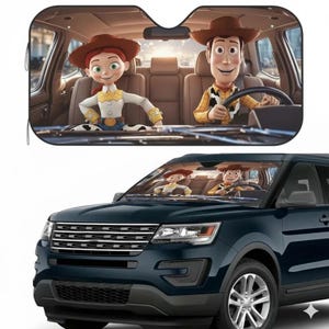 May include: A car sunshade featuring the characters Woody and Jessie from the animated film Toy Story. The sunshade is shown in use, with the characters visible through the windshield of a dark blue SUV.