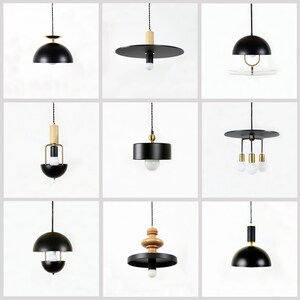 May include: Nine different black pendant lights with various styles, including a dome shape, a flat disc, and a cage design. Some lights feature wooden accents and multiple bulbs.