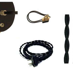 May include: A black electrical cord with a black plug and a black in-line switch. The cord is coiled and ready to be used. There are three different colors of electrical cord: black, white, and gold.