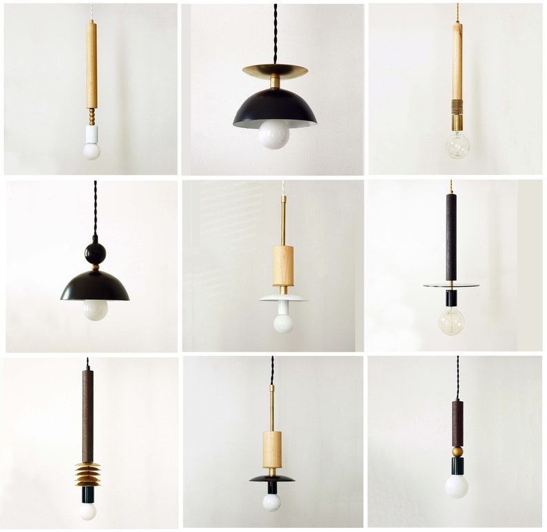 May include: A collection of nine pendant lights featuring various designs with combinations of wood, black, white, and metallic gold components. Each fixture includes a cord, a central structural element, and a single exposed light bulb.
