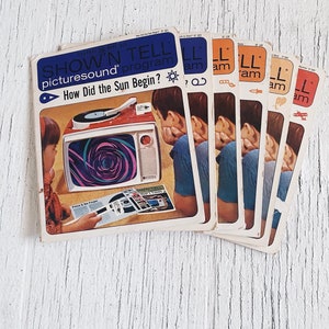 May include: A set of vintage "Show 'n Tell" picture sound program records. The records are in a stack and feature a colorful design with a child listening to a record player. The text on the front of the record says "How Did the Sun Begin?"