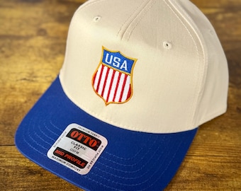Gorra snapback Otto con el logotipo del escudo de USA Hockey - Natural/Azul - NHL / Juegos Olímpicos 2026