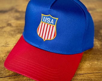 Gorra snapback Otto con el logotipo del escudo de USA Hockey - Rojo/Azul - NHL / Juegos Olímpicos 2026
