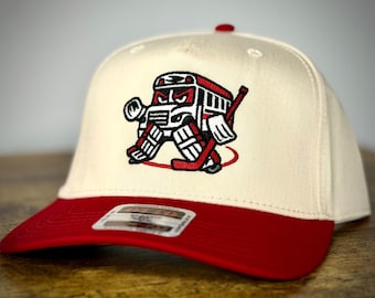 Gorra Otto SnapBack "Bus In Net" de los Carolina Hurricanes, color rojo/natural, de la NHL Canes