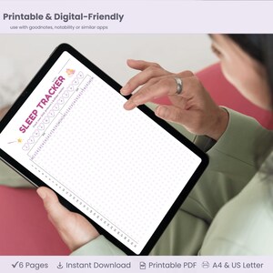 May include: A digital sleep tracker displayed on a tablet. The screen shows a chart with the words "Sleep Tracker" at the top. The tablet is held by a person. The image also includes the text "Printable & Digital-Friendly".