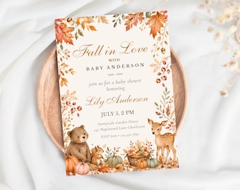 May include: A rectangular baby shower invitation card featuring a fall-themed border of autumn leaves, acorns, and berries. The text reads Fall in Love with Baby Anderson, honoring Lily Anderson, July 5, 2 PM, Sunnyvale Garden House, 245 Maplewood Lane Charleston, RSVP Jenn 123-456-7890. Illustrations include a bear, a squirrel, a deer, and pumpkins.