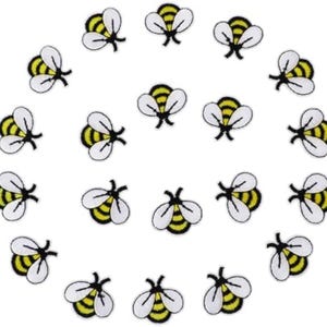 May include: A collection of seventeen individual embroidered bee patches arranged in a circular pattern. Each patch features a yellow and black striped body with white wings and black outlines, showcasing a consistent insect design throughout.