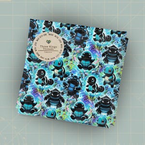 May include: A folded fabric featuring a repeating pattern of blue and black cartoon characters on a swirling, colorful background. The fabric has a tag that reads "Three Kings Threads Fabrics".